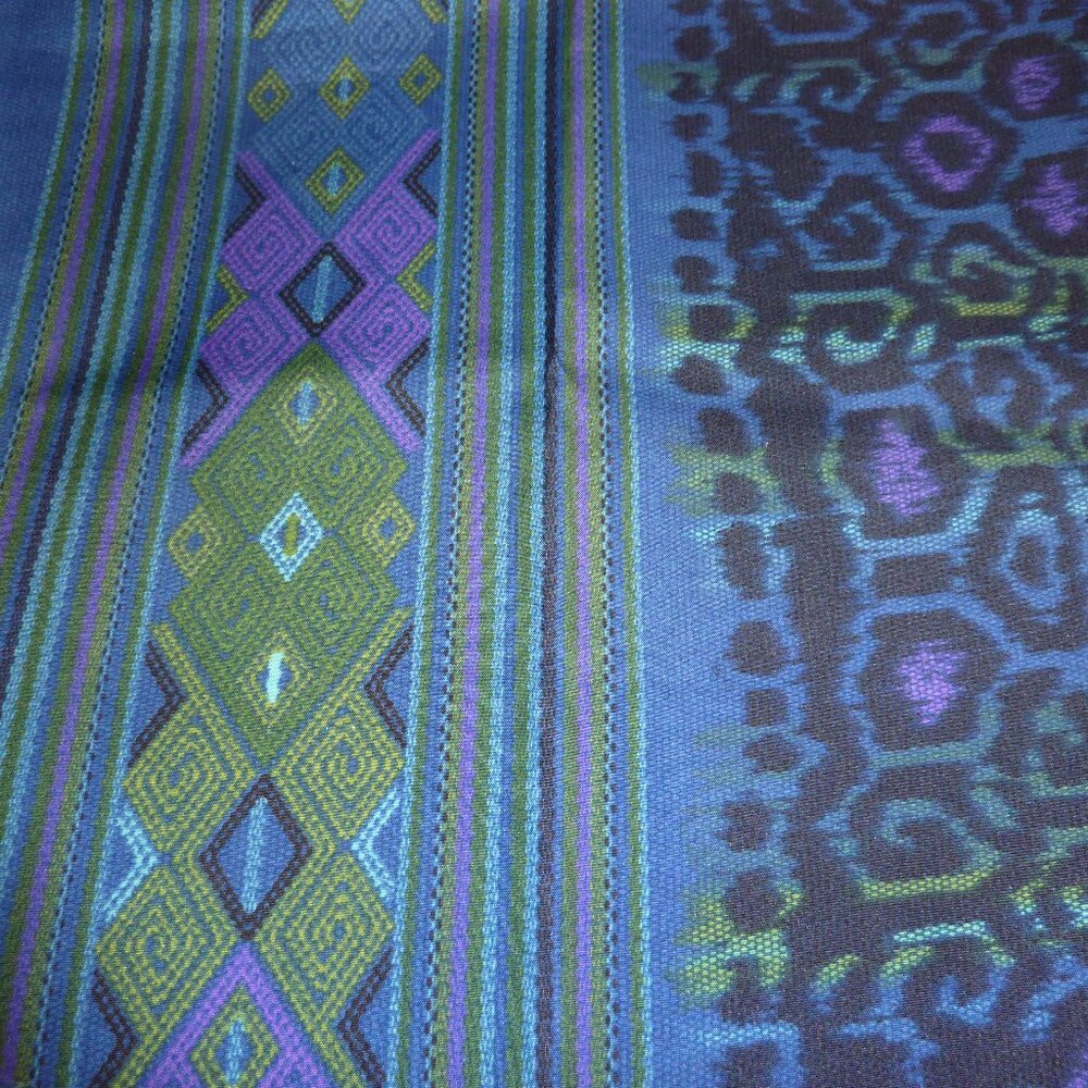 Ethnic patterned fabric with a leopard print center and clean geometric borders